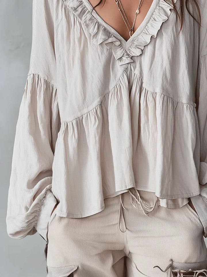 Narella - Blusa con holanes y escote en V