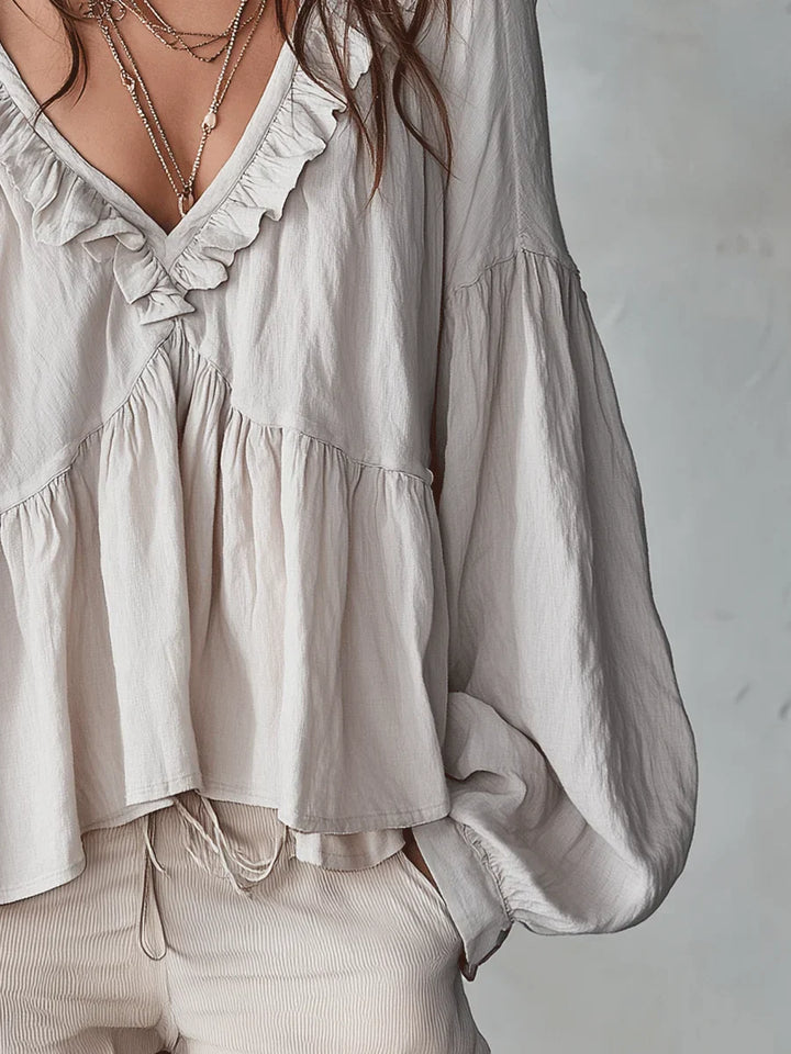 Narella - Blusa con holanes y escote en V